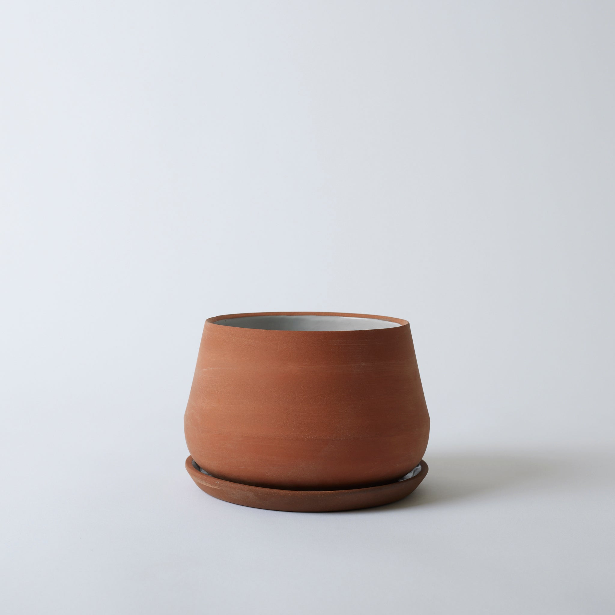 Silo image of the 8" terra cotta Rancho Planter. It is a beautiful natural clay color.