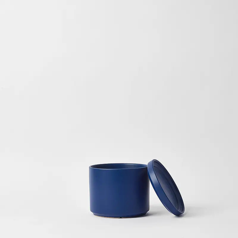 Blue 6 Inch ceramic container with lid on a white background