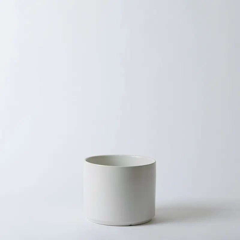 White 8 Inch ceramic pot on a light gray background