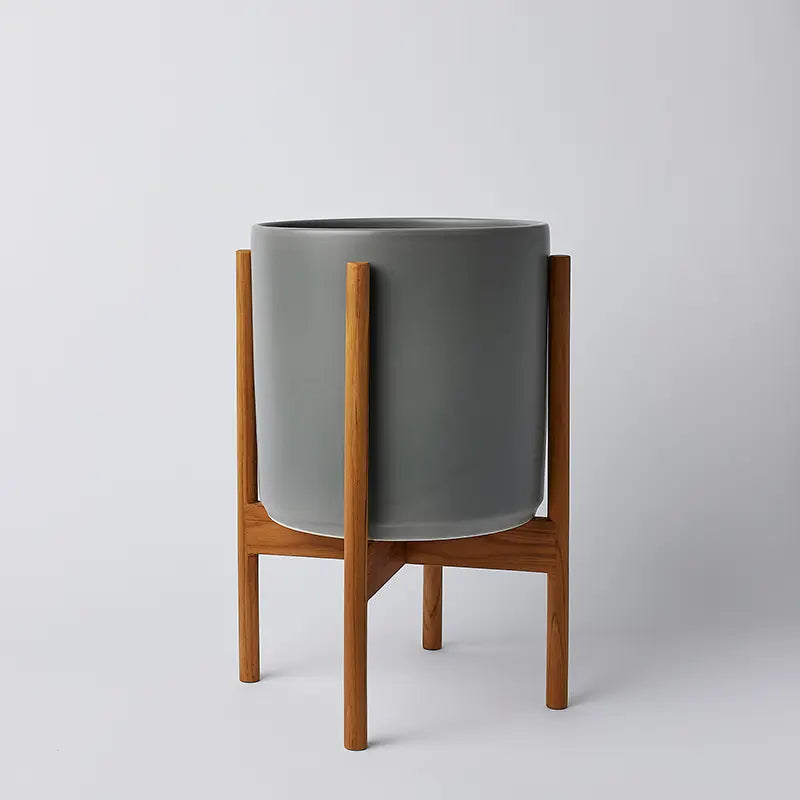 Gray 10 inch planter on a natural rounded stand against a light gray background