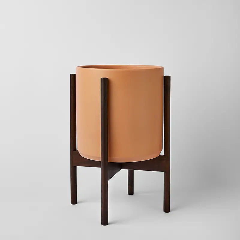 PeachyCotta 10 Inch Ceramic planter with dark rounded stand on a light gray background