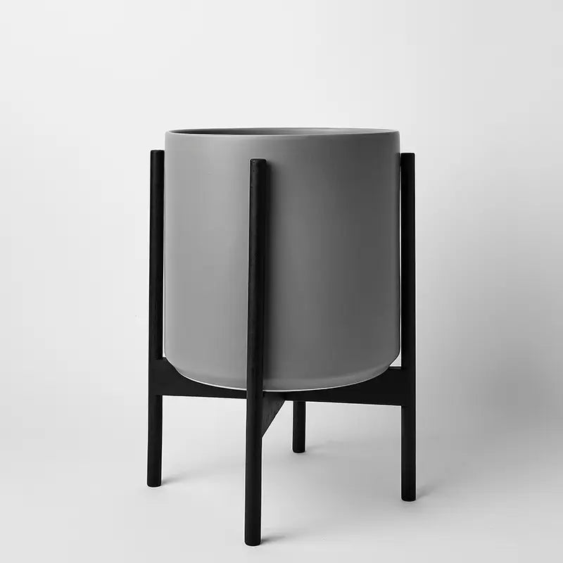 Gray 12 Inch planter with black rounded stand on a white background