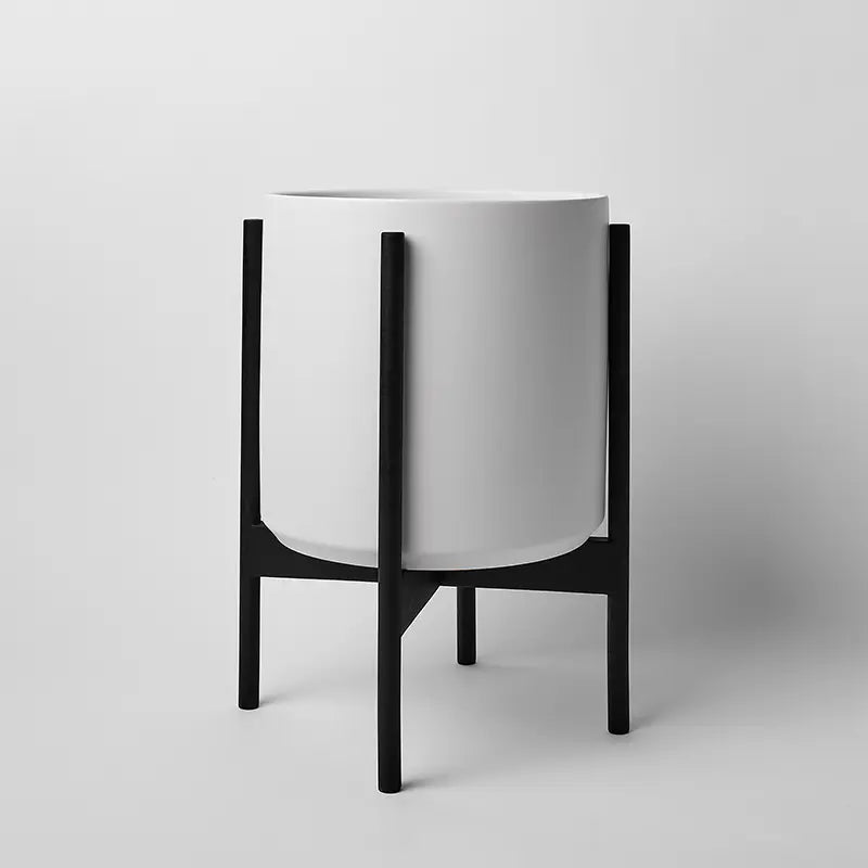 White 12 Inch planter with black rounded stand on a light gray background