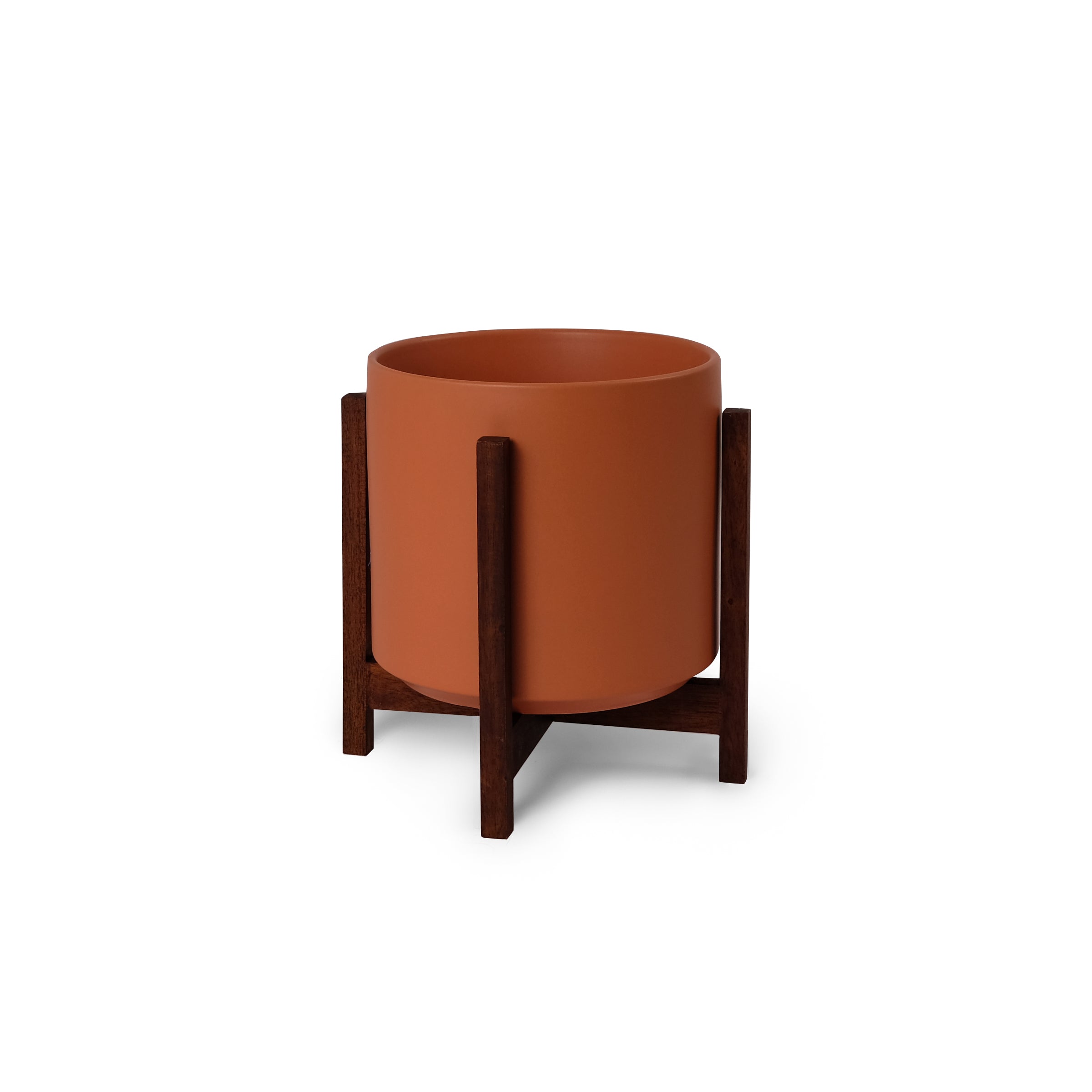 Ceramic planter with wooden stand on a white background