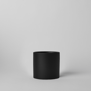 Black 4 Inch cylindrical pot on a light gray background