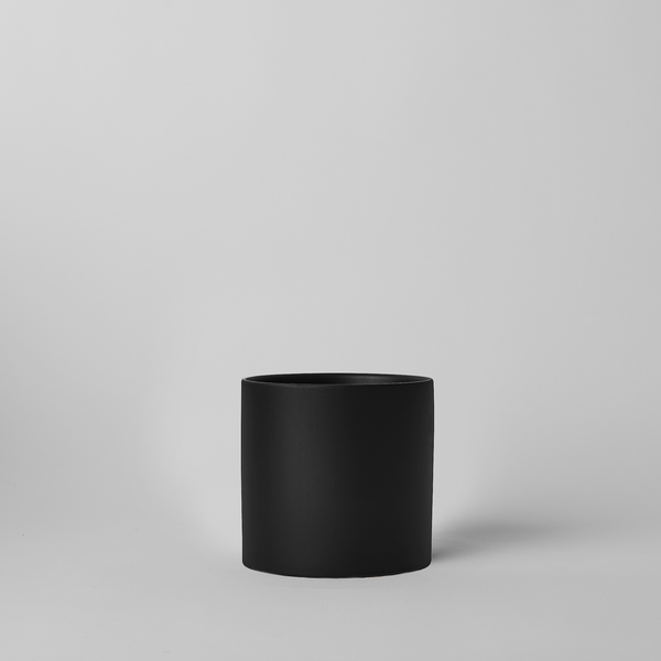 Black 4 Inch cylindrical pot on a light gray background