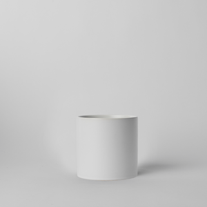 White 4 Inch cylindrical planter on a light gray background