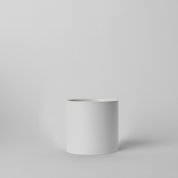 White 4 Inch cylindrical planter on a light gray background