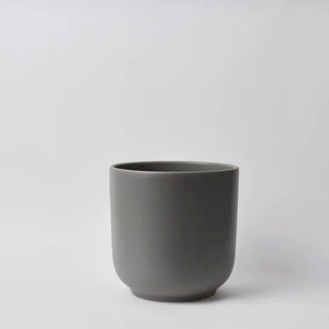 Dark 10 Inch gray ceramic cup on a light gray background