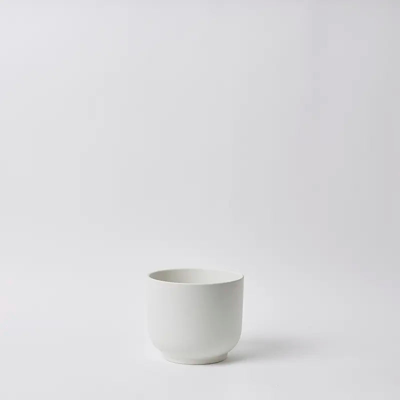 White 6 Inch ceramic cup on a light gray background