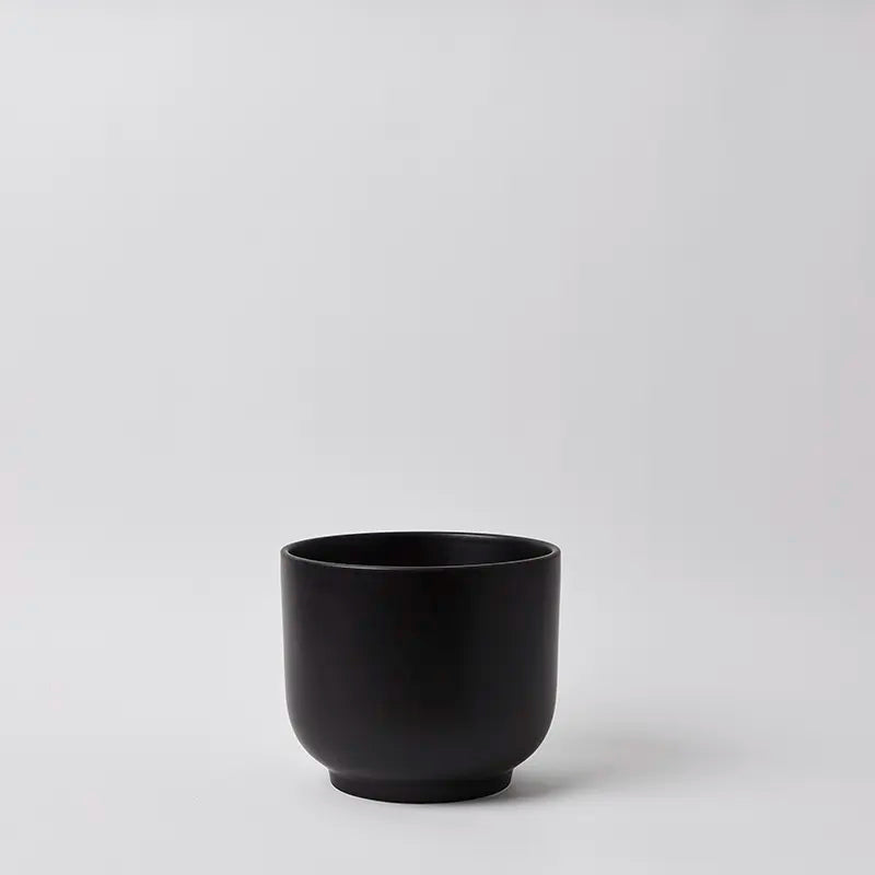 Black 8 Inch ceramic cup on a light gray background