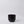 Black ceramic cup on a light gray background