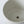 Close-up of a beige ceramic sink basin on a white background