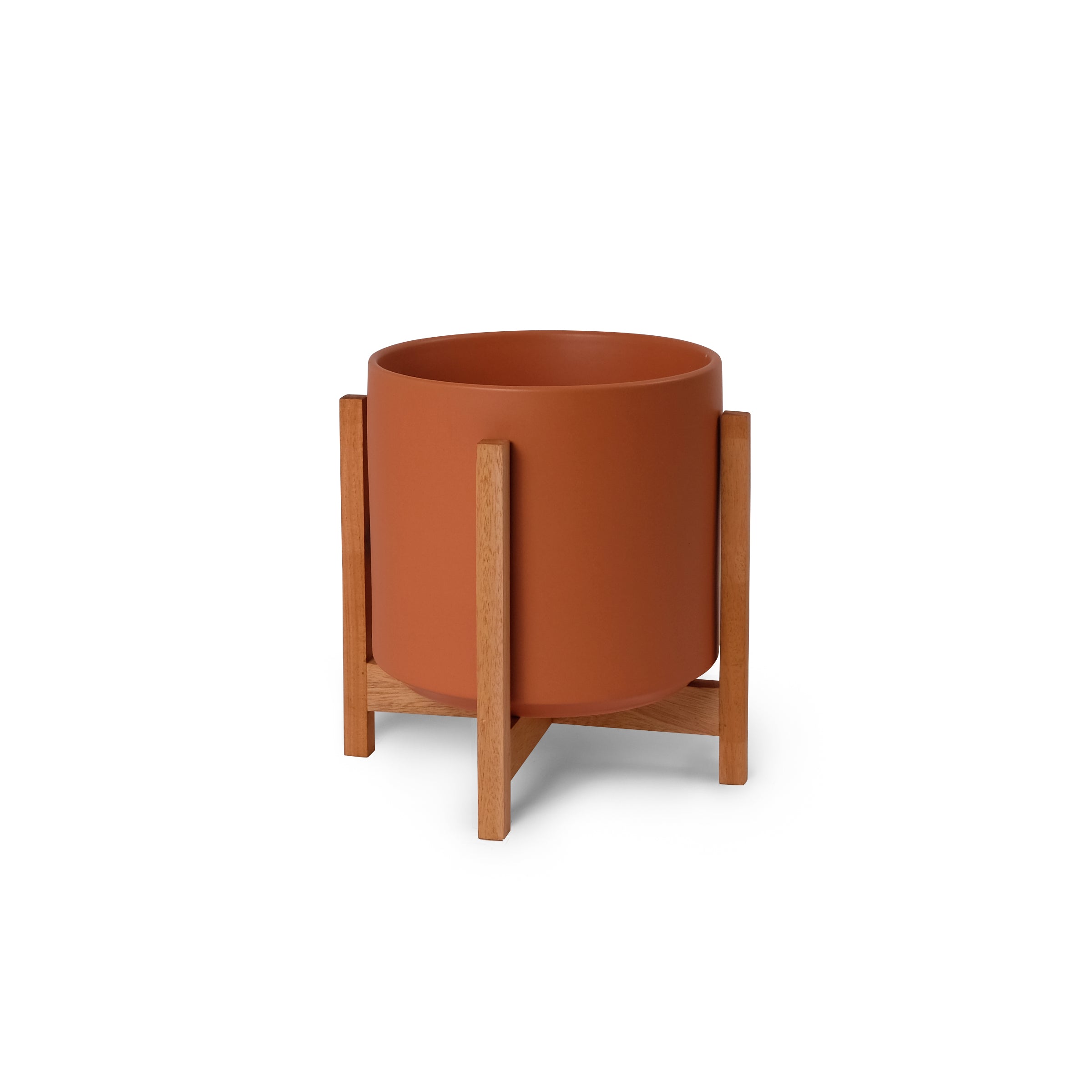 Ceramic planter with wooden stand on a white background