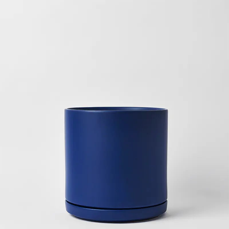 Blue 15 Inch cylindrical planter on a light gray background