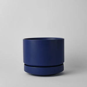 Blue 10 Inch cylindrical planter on a gray background