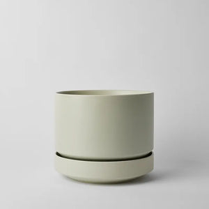 Mint 10 inch plant pot on a light gray background
