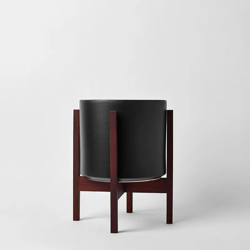 Black 10 Inch planter with dark square stand on a white background