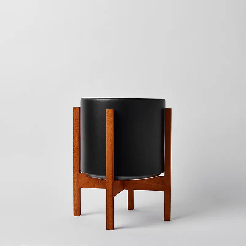 Black 10 Inch planter with light square stand on a light gray background