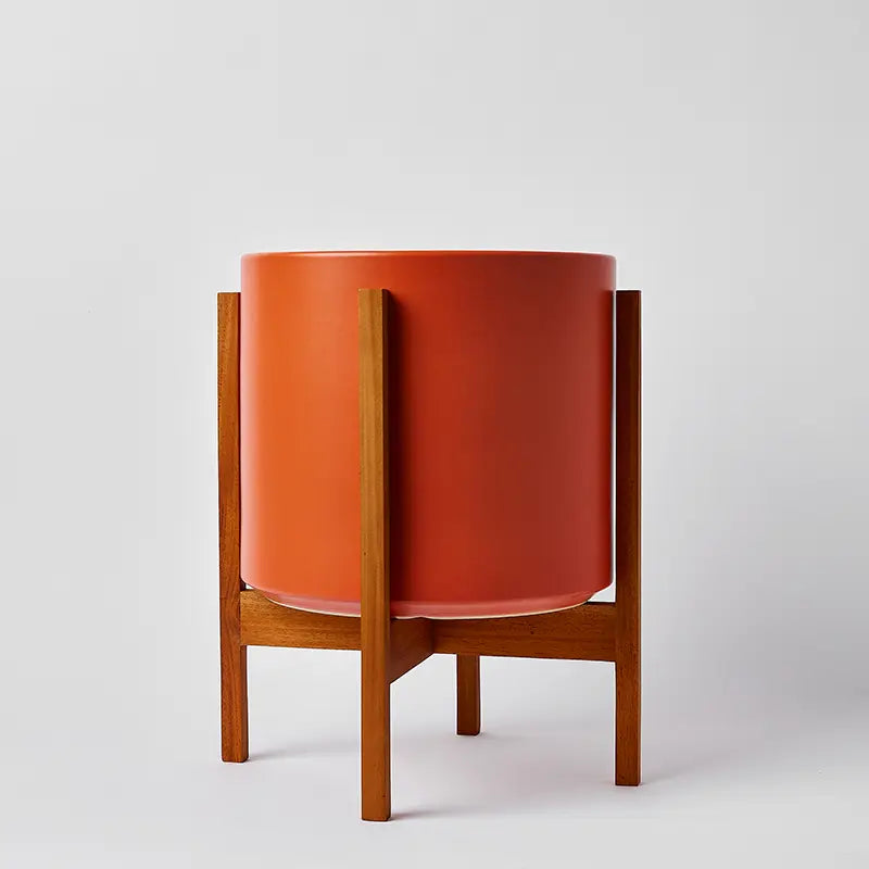 Rust 12 Inch cylindrical planter with light square stand on a white background