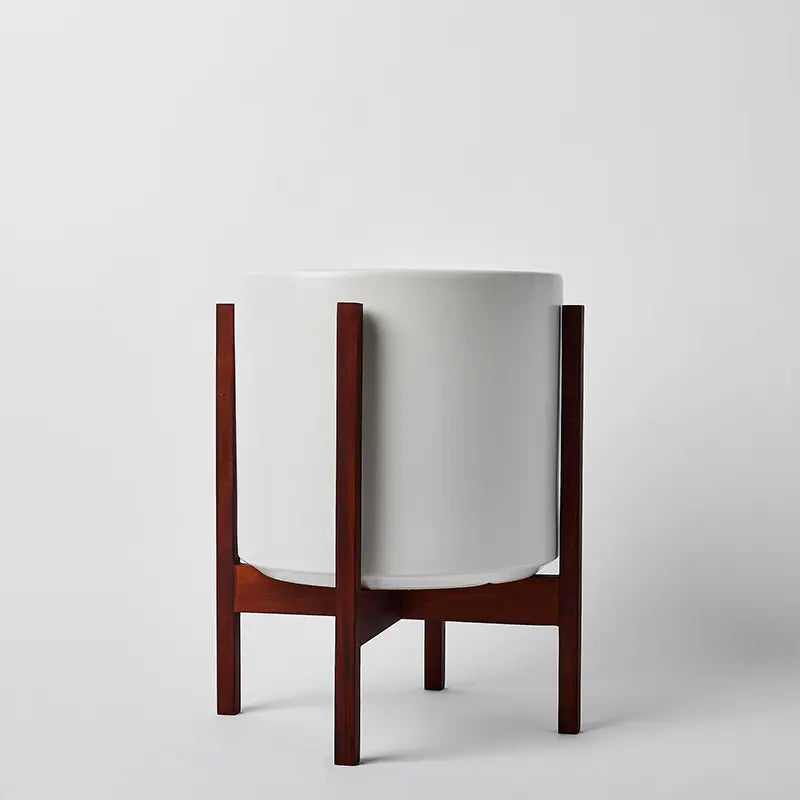 White 12 Inch planter with dark square stand on a white background