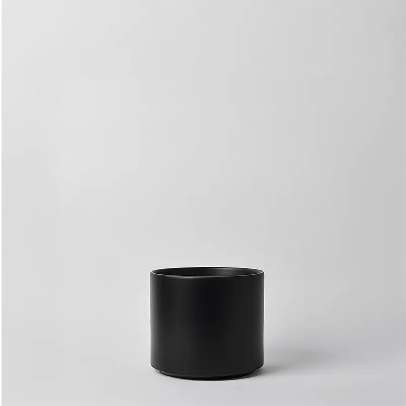 Black 8 Inch cylindrical pot on a light gray background