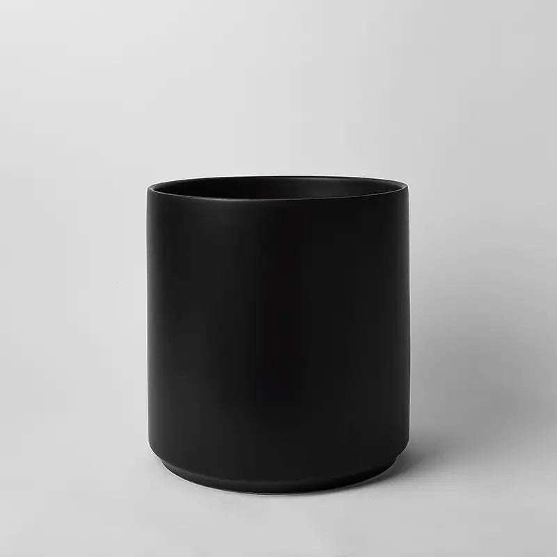 Black 14 inch cylindrical vase on a light gray background