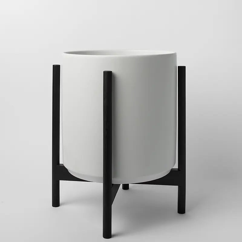 White 14 Inch planter with black rounded stand on a light gray background