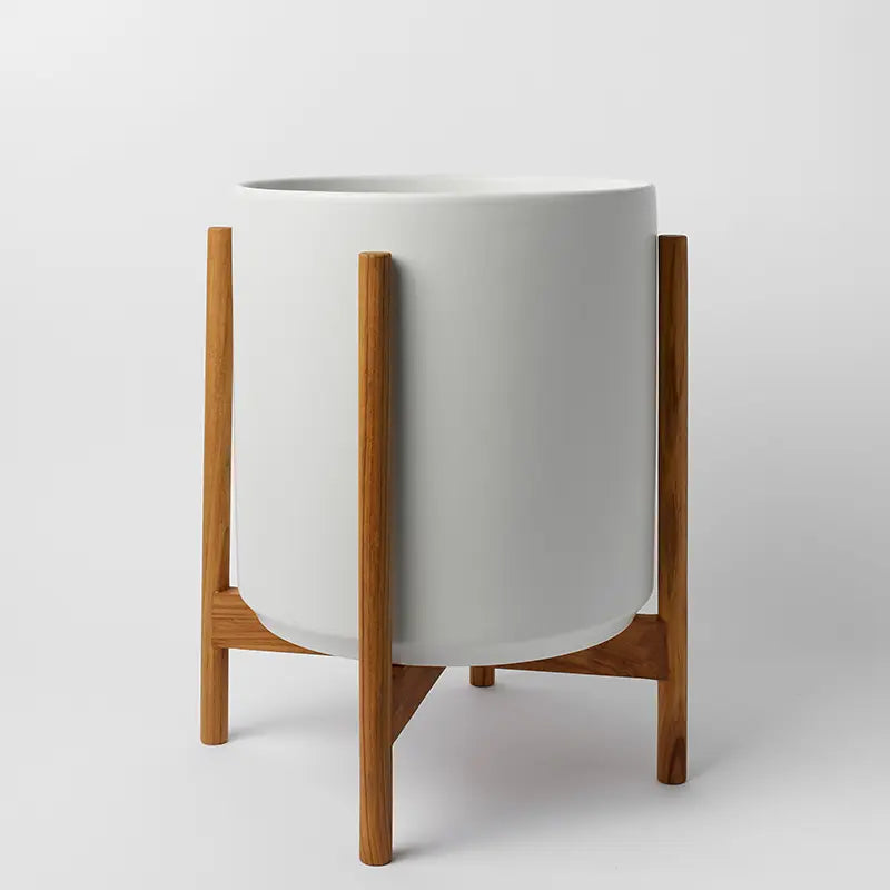 White 14 Inch planter with light rounded stand on a light gray background