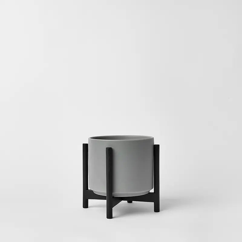 Gray 6 Inch planter with black rounded stand on a light gray background