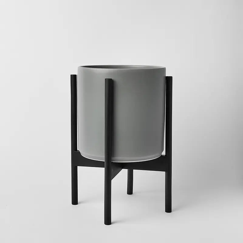 Gray 10 Inch planter with black rounded stand on a light gray background