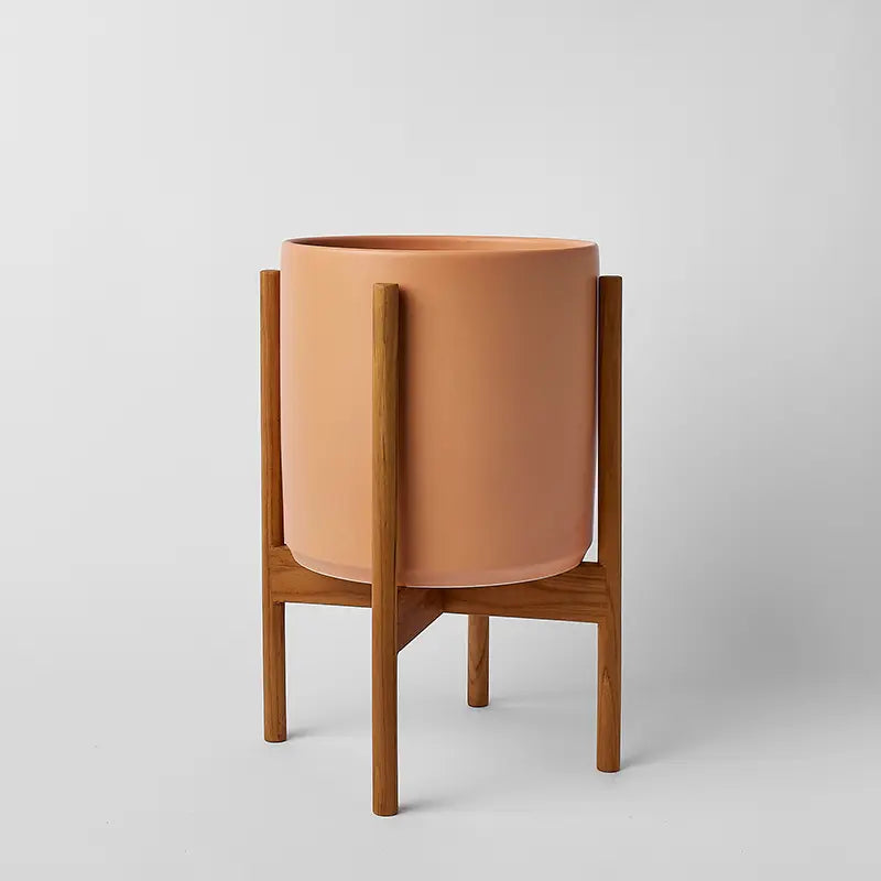 Ceramic 10 Inch planter with light rounded stand on a natural gray background