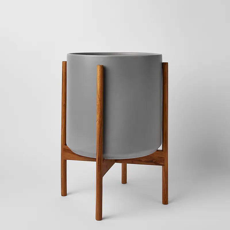 Gray 12 Inch planter with natural rounded stand on a light gray background