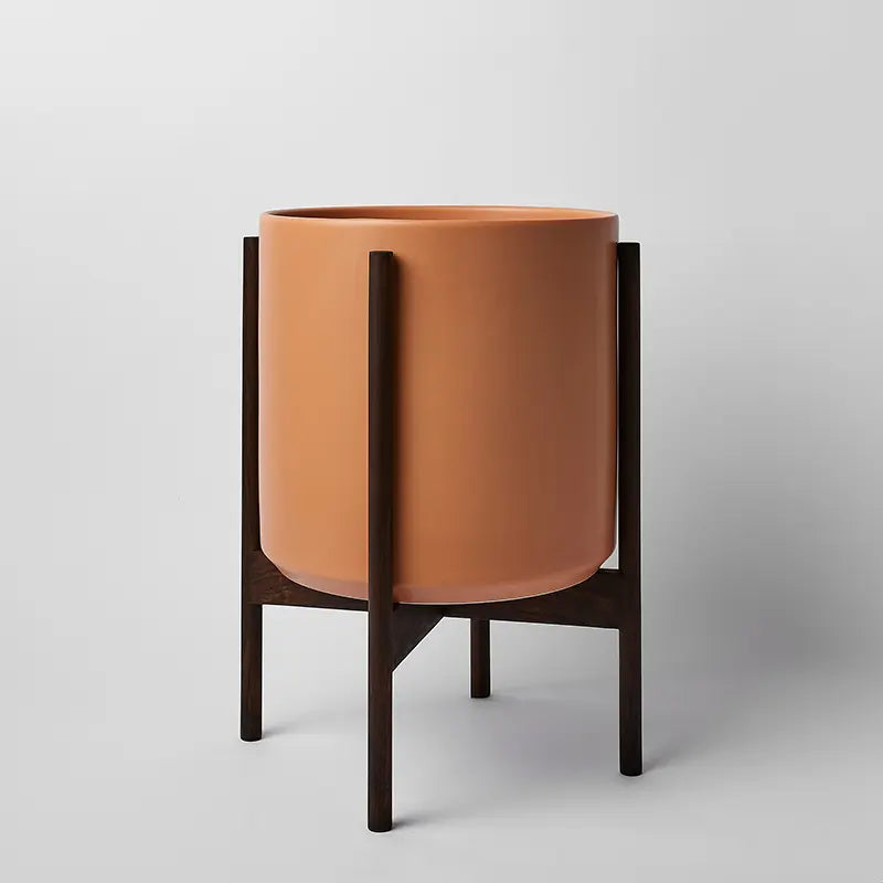 PeachyCotta 12 Inch Ceramic planter with dark rounded stand on a light gray background